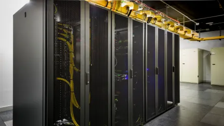 Black computer servers with yellow cables