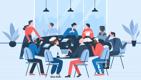 A group of people sitting at a round table