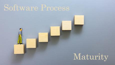 Man climbing steps toward Software Process Maturity