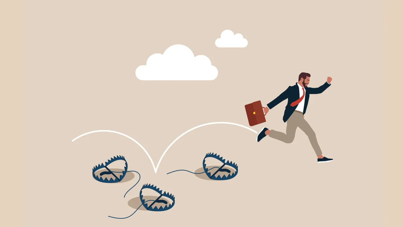 Business man escaping animal traps